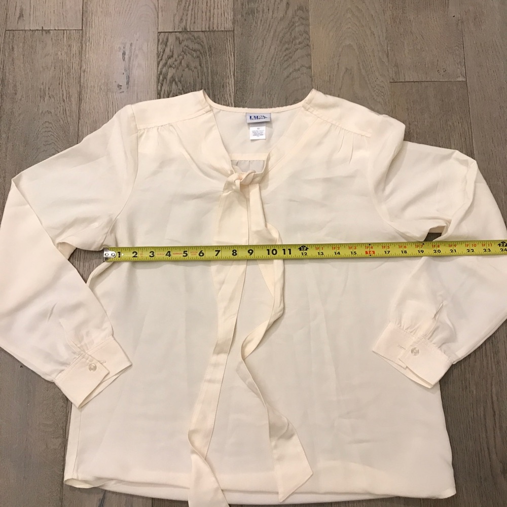 Cream tie front long sleeve blouse